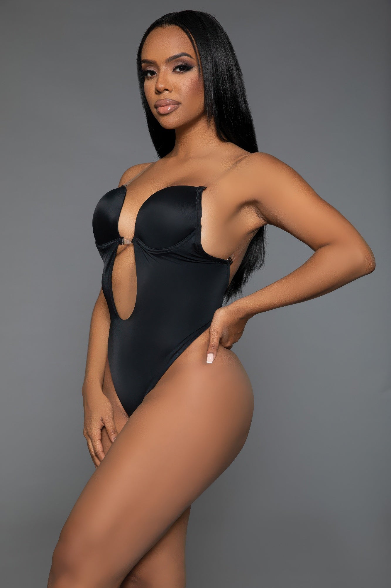 Black curvy bodysuit shaper with a bold cutout design for a sleek silhouette and enhanced curves