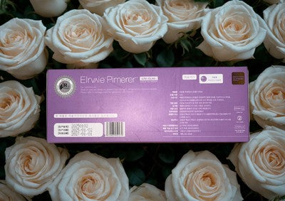 Elravie lip filler hyaluronic acid box displayed among white roses for beauty treatment
