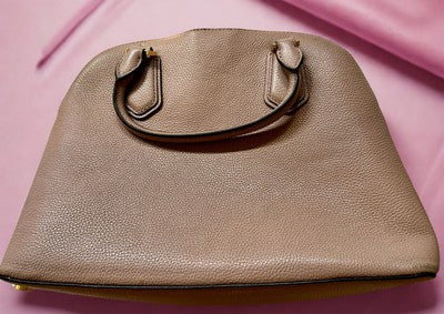 Michael Kors handbag bundle featuring a stylish, textured handbag in soft taupe color