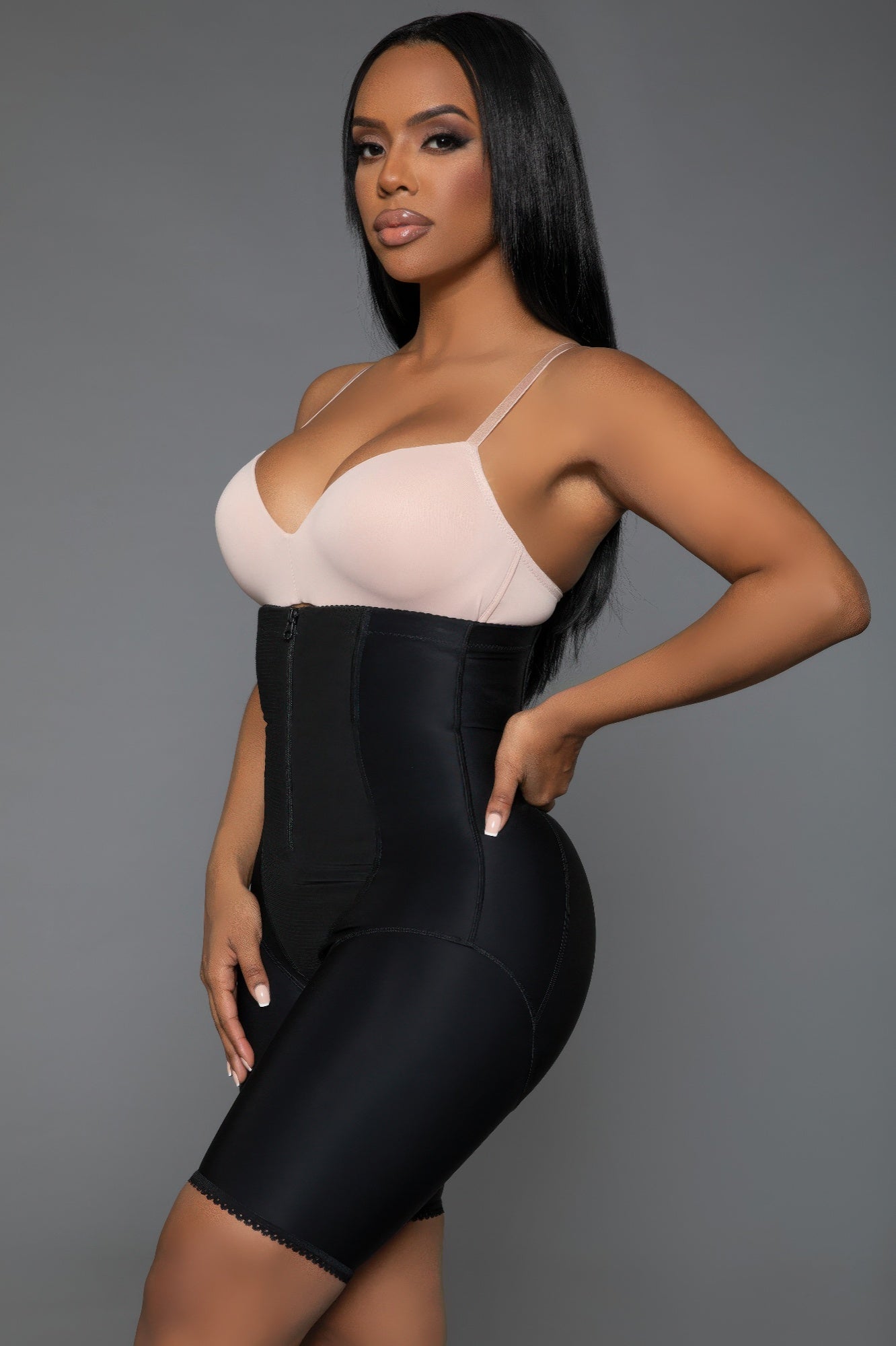 Curve-enhancing shapewear in black featuring a front zipper and high waist for a flattering fit