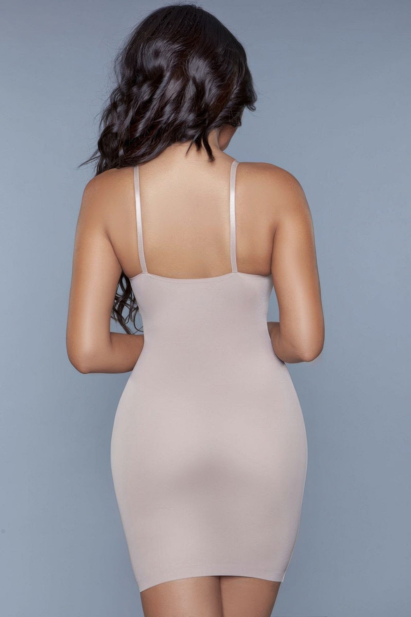 Curved shapewear dress in nude color with adjustable straps for a flattering fit.