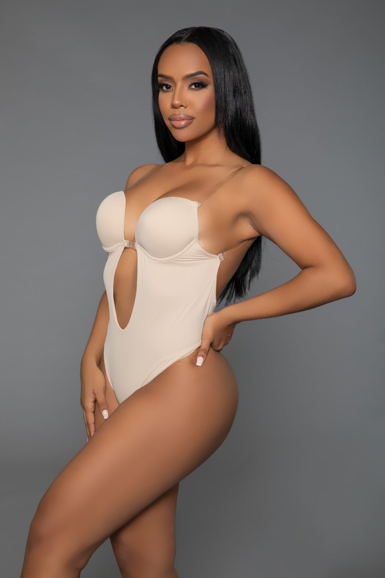 Stylish curvy bodysuit shaper in beige, designed for a smooth silhouette and confident wear.