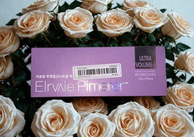 Elravie lip filler hyaluronic acid packaging in purple with elegant rose background