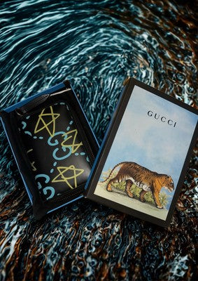 Gucci Ghost zip wallet preowned with unique design, comes with original packaging and artistic box