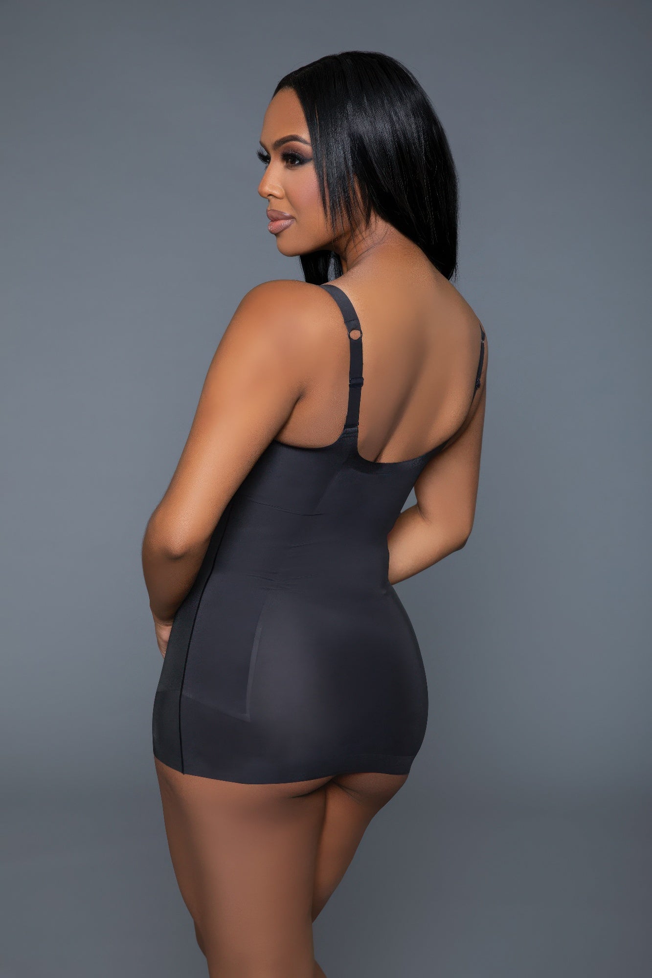 Elegant black luxury shapewear top with adjustable straps for a flattering fit and seamless look