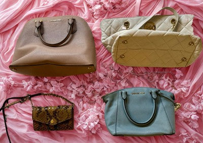 Michael Kors handbag bundle featuring four stylish handbags in various colors and designs
