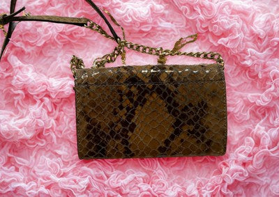 Michael Kors handbag bundle featuring a stylish snakeskin clutch with a chain strap